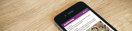 An iphone which shows the Justgiving website mobile view on the screen