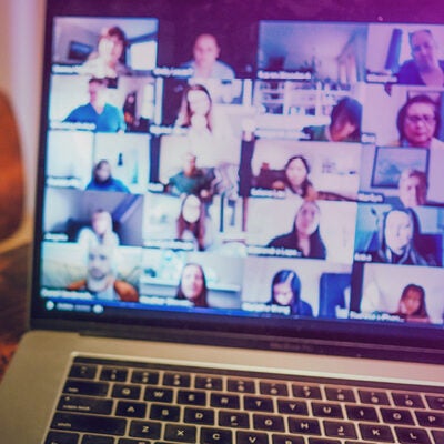 A group of people taking part in a virtual escape room